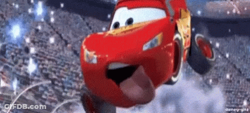Lightning Mcqueen Is Flying Through The Air With His Tongue Hanging Out . GIF