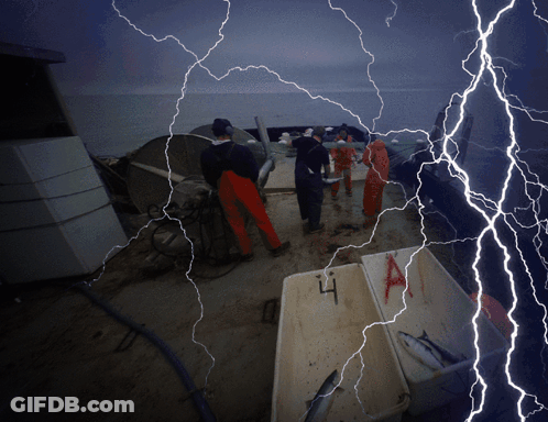 Lightning Strikes A Group Of People On A Boat With Boxes Of Fish In The Foreground GIF