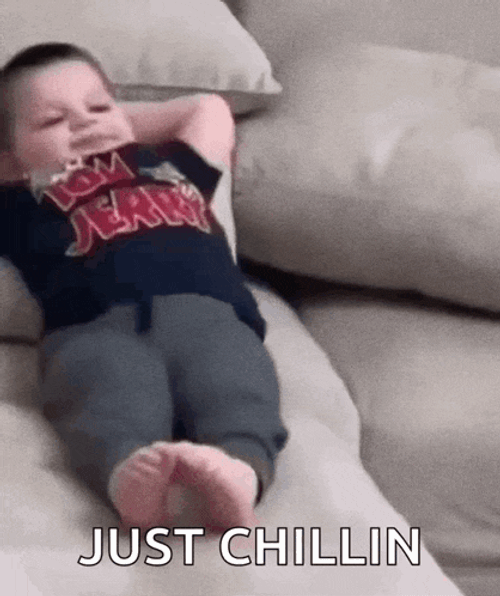 Lil Kid Chilling Chilling On Couch GIF