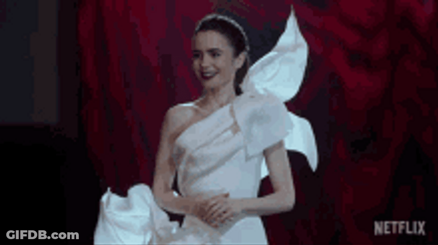 Lily Collins Excitedly Showing Off Her Dress GIF