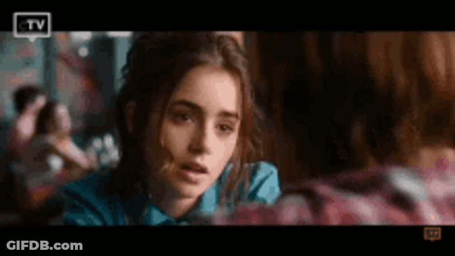 Lily Collins Looking Down While Listening GIF