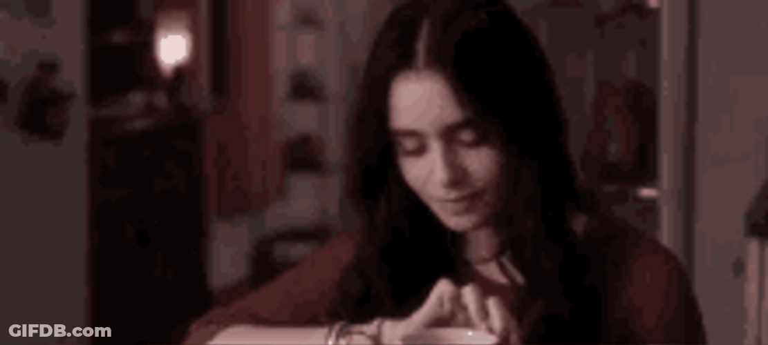 Lily Collins Playing With Her Fingers GIF