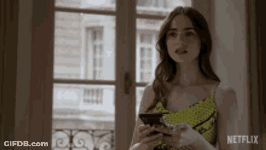 Lily Collins Sadly Looking At Her Phone GIF
