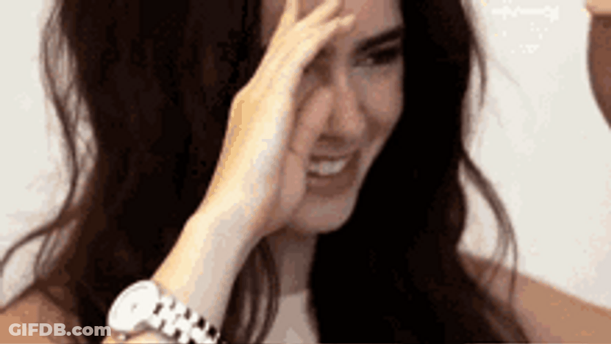 Lily Collins Touching Her Hair While Smiling GIF