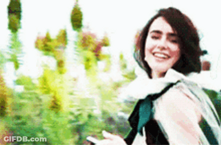 Lily Collins Waving Goodbye GIF
