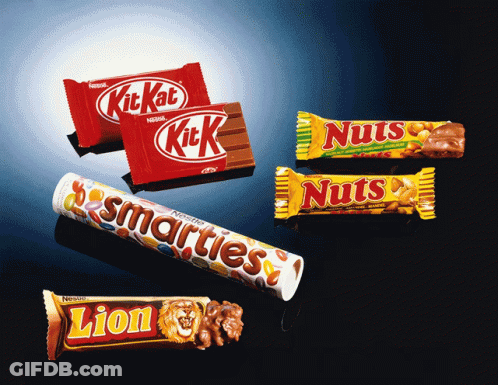 Lion Candy Bar Next To Kit Kat And Nuts Bar GIF