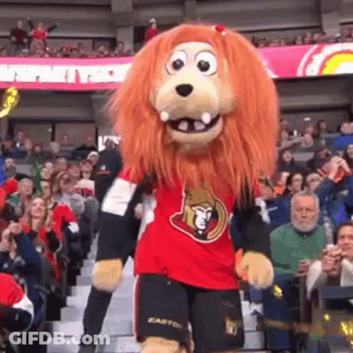 Lion Mascot Dancing In Front Of Crowd GIF