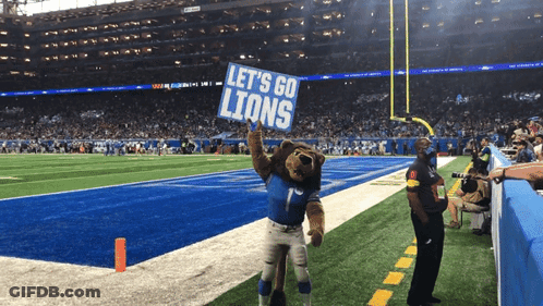 Lion Mascot Holding Let's Go Lions Sign GIF