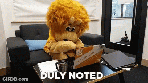 Lion Mascot With Laptop Saying I'm On Loan GIF