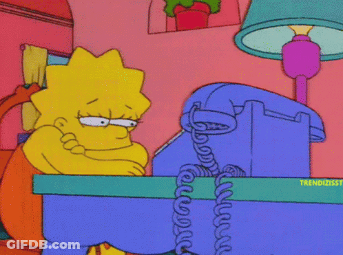 Lisa Simpson Sitting At Desk With Phone GIF