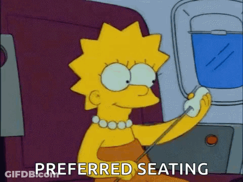Lisa Simpson Sitting On Airplane Talking On Cell Phone GIF