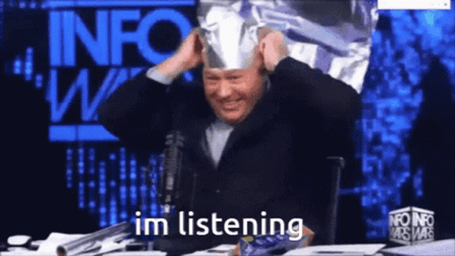 Listening Host Puts On Tin Foil Hat GIF