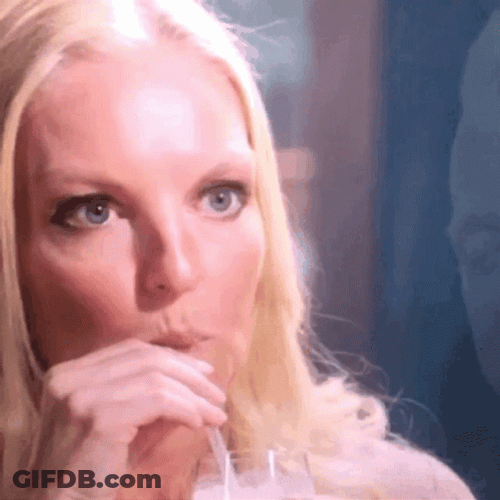 Listening Intently While Sipping Juice GIF