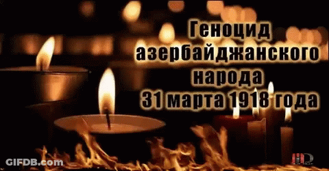 Lit Candle In Front Of Black Background With Russian Writing GIF