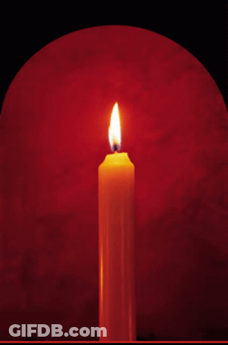 Lit Candle On Red Background GIF