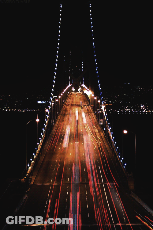 Lit Up Bridge With No Trucks Sign GIF