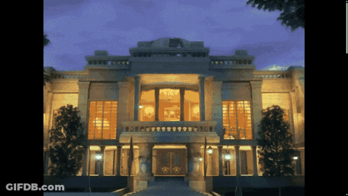 Lit Up Large Building With Windows GIF