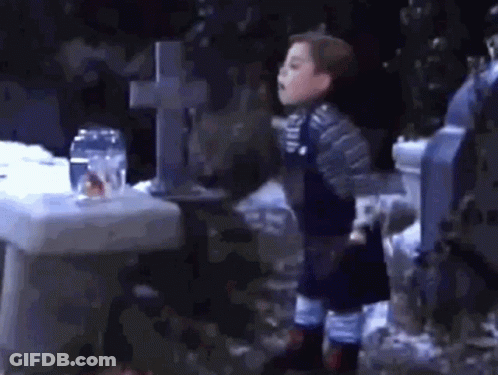 Little Boy At Cemetery GIF