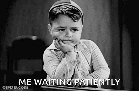 Little Boy At Desk With Hand On Chin GIF