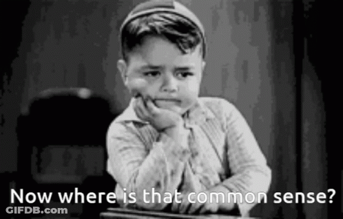 Little Boy At Desk With Hand On Chin Saying Now Where Is That Common Sense GIF