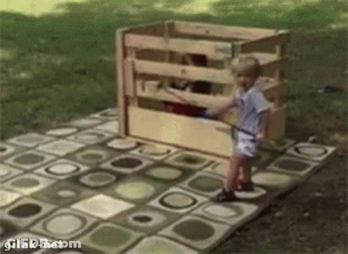 Little Boy Before Wooden Crate Saying Gifak-Net GIF