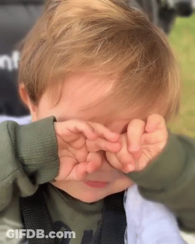 Little Boy Covering Eyes With Hands GIF