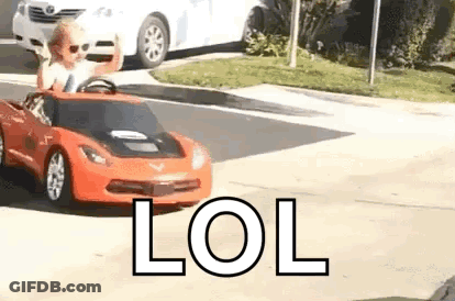 Little Boy Driving Red Toy Car GIF