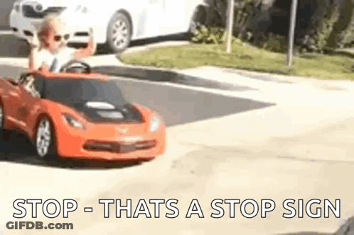 Little Boy Driving Toy Car On Street GIF