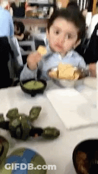 Little Boy Eating Bowl Of Food GIF