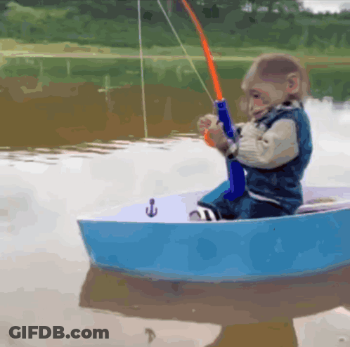 Little Boy Fishing In Small Boat GIF