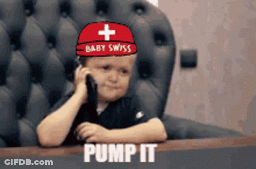 Little Boy In Baby Swiss Hat Talking On Cell Phone GIF