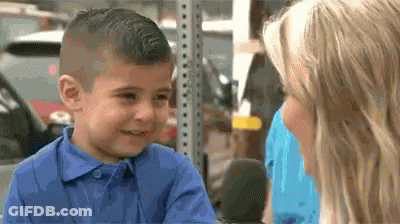 Little Boy In Blue Shirt Talking To Woman GIF