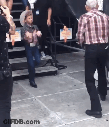 Little Boy In Cowboy Hat On Stairs GIF