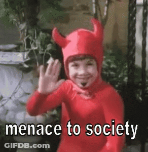 Little Boy In Devil Costume Waving Says Menace To Society GIF