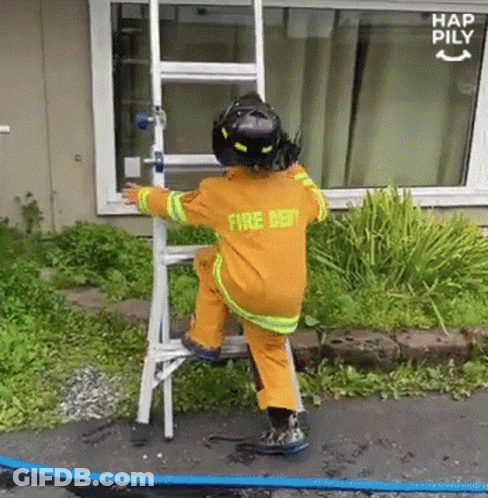 Little Boy In Fire Dept Uniform Climbing Ladder GIF