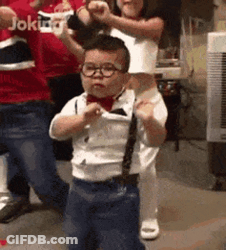 Little Boy In Glasses And Tie Dancing GIF