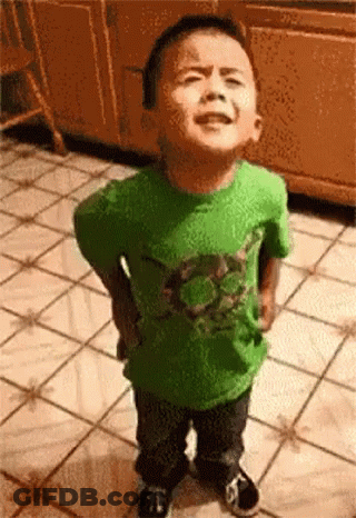 Little Boy In Green Shirt Hands On Hips GIF