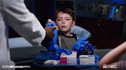 Little Boy In Hospital Bed With NBC Gloves Box GIF