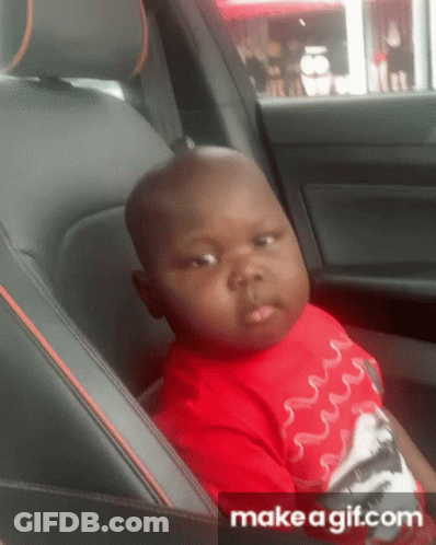 Little Boy In Red Shirt Sitting In Back Seat Of Car GIF