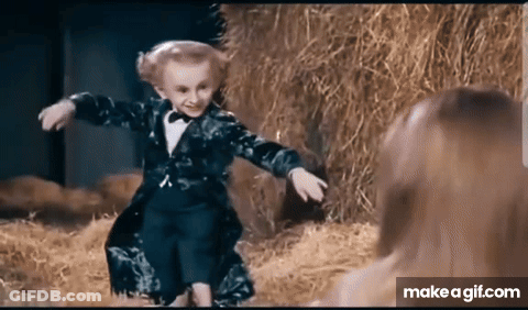 Little Boy In Tuxedo Dancing In Front Of Woman GIF