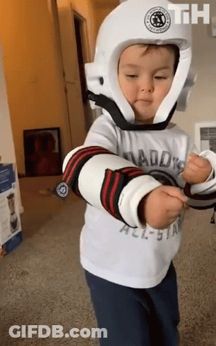 Little Boy In White Helmet With Daddy's All-Star Shirt GIF