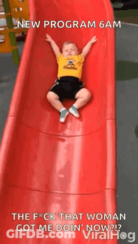 Little Boy Laying On Red Slide New Program 6 AM GIF