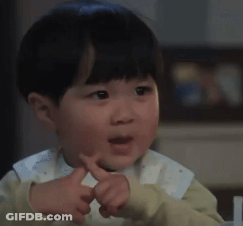 Little Boy Making Funny Face Pointing GIF