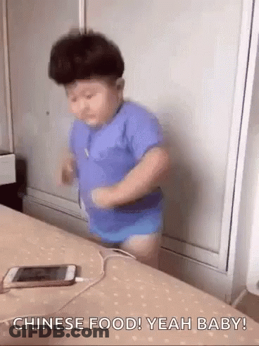 Little Boy On Bed With Plugged Cell Phone GIF