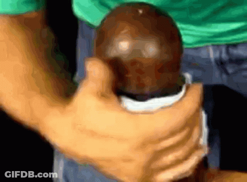 Little Boy Playing With Logs In Grass GIF