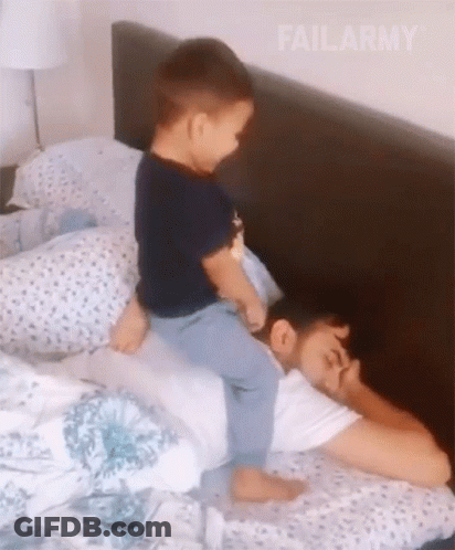 Little Boy Riding On Sleeping Man GIF