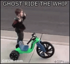 Little Boy Riding Tricycle On Sidewalk GIF
