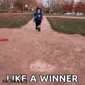 Little Boy Running Down Dirt Path Like A Winner GIF