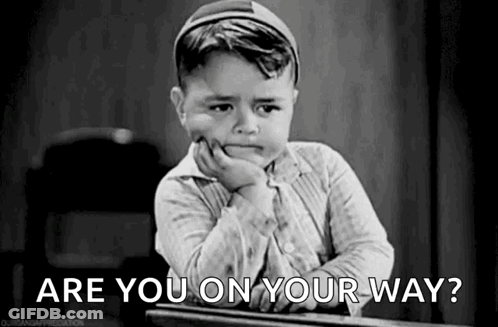 Little Boy Sitting At Desk Asking Are You On Your Way? GIF