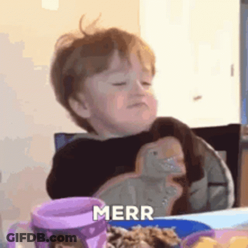 Little Boy Sitting At Table With Food And Water GIF